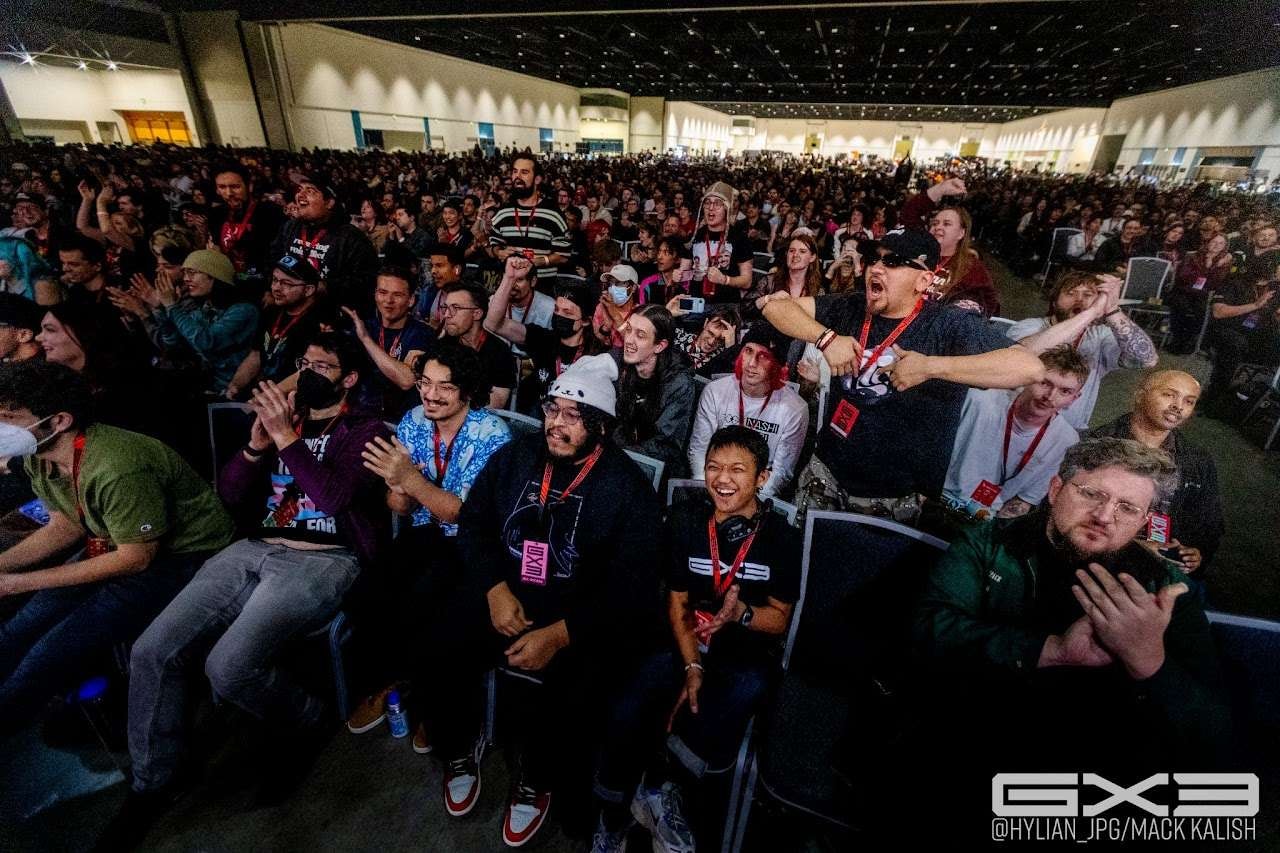 A packed GENESIS X3 crowd cheers and reacts to a match
